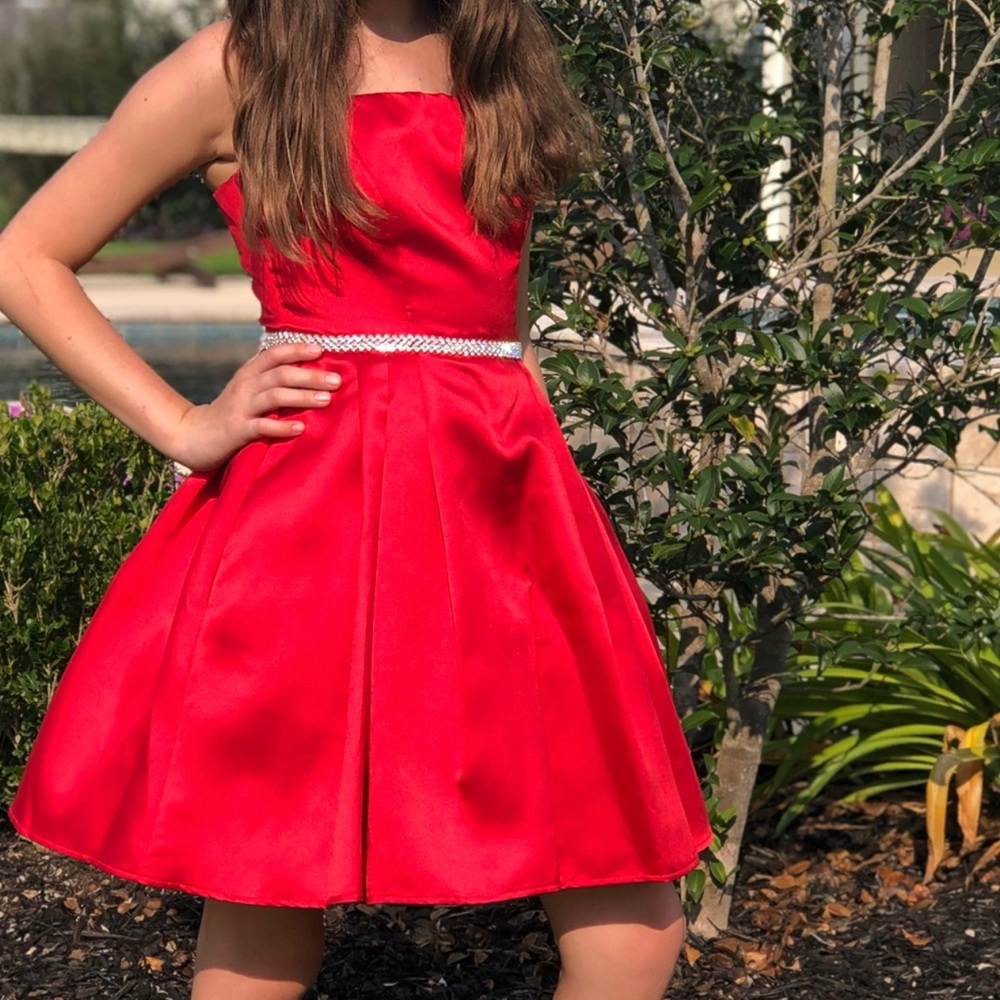 Red homecoming dress with rhinestone detailing and pockets